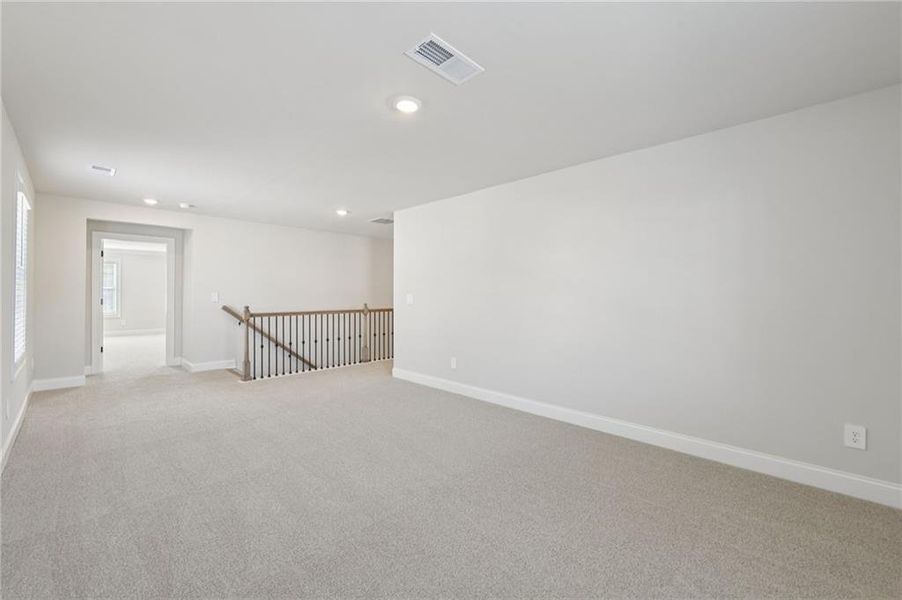 Spacious, unfurnished interior of a new home in Vines at Mill Creek - Estate Series, Braselton (Image 26).