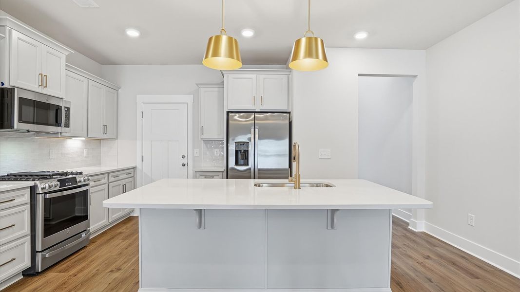 First-rate kitchen with a smaller island and superior cabinetry in a thoughtfully designed space at Village at Midway First-rate kitchen with a smaller island and superior cabinetry in a thoughtfully designed space at Village at Midway