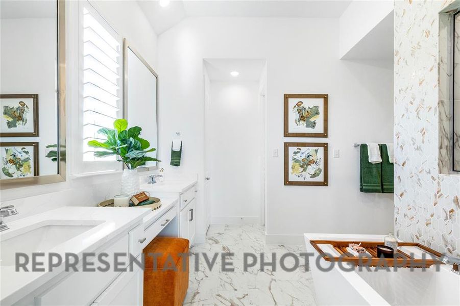 Bathroom featuring double vanity, two vanities, light marble finish flooring, a tub, and recessed lighting Bathroom featuring double vanity, two vanities, light marble finish flooring, a tub, and recessed lighting