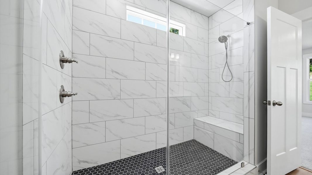 Sophisticated primary bathroom with an expansive walk-in shower and refined finishes in Anderson, SC