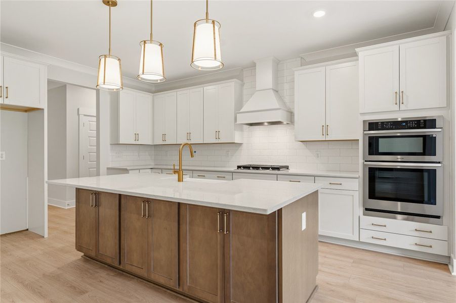A well-lit, open-concept kitchen showcasing a spac
