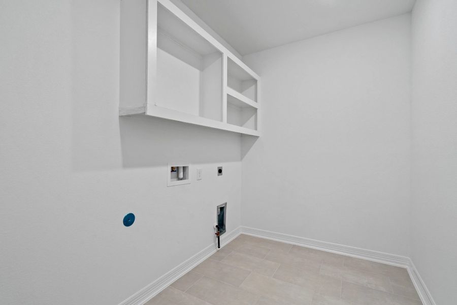Utility room. Note: Sample product photo. Actual exterior and interior selections may vary by homesite. Photo may be virtually staged