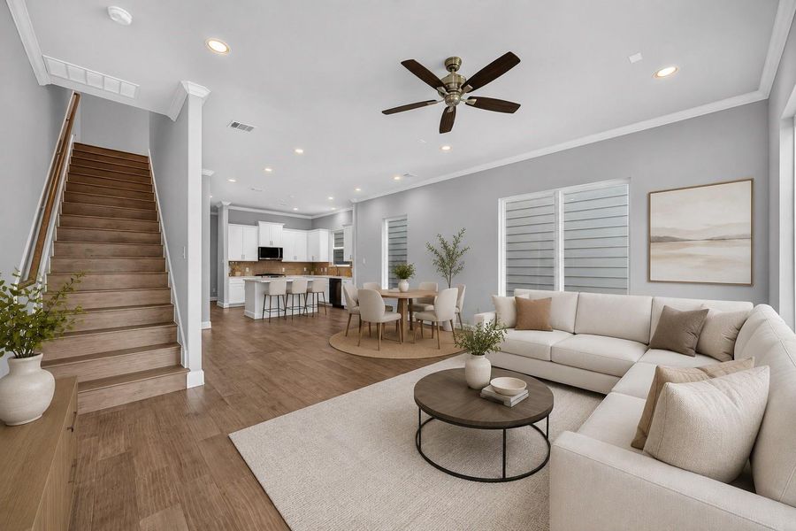 Living Room with Natural Light – Tall ceilings, recessed lighting, and oversized windows make this living space bright, airy, and perfect for relaxation. *Image Virtually Staged.*