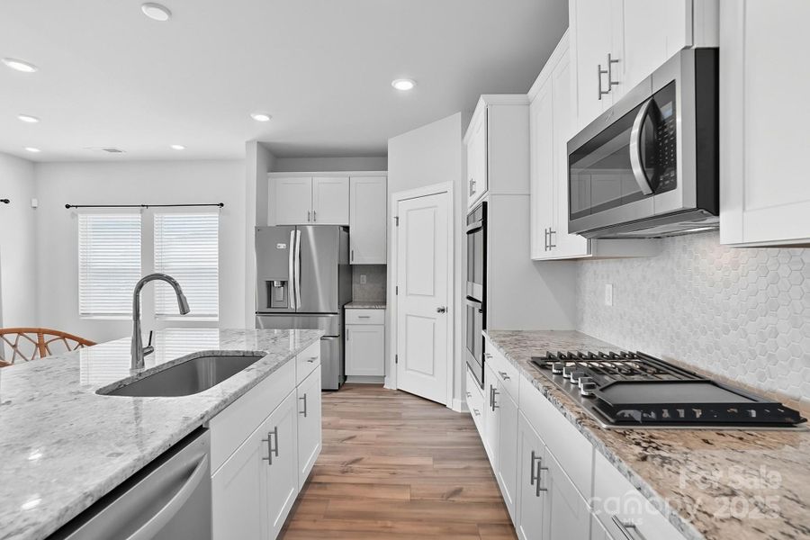 Furnished interior view inside a new home in Solena at the Vineyards II, Charlotte (Image 15). Furnished interior view inside a new home in Solena at the Vineyards II, Charlotte (Image 15).