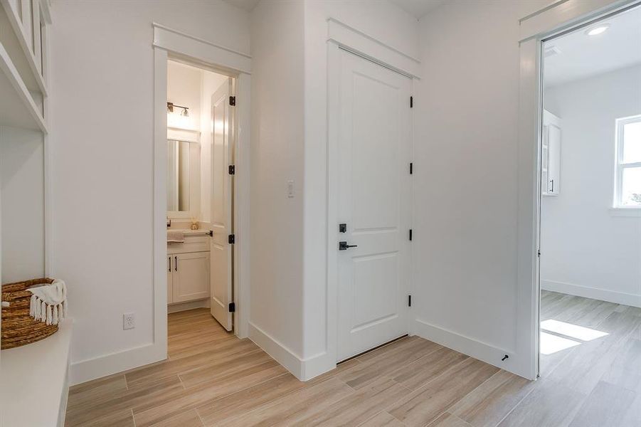 Mud Bench leading to garage, half-bath or the oversized laundry room