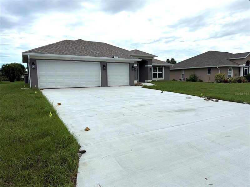 Front exterior of a new home in Rotonda, Rotonda West, FL, highlighting curb appeal (Image 7). Front exterior of a new home in Rotonda, Rotonda West, FL, highlighting curb appeal (Image 7).