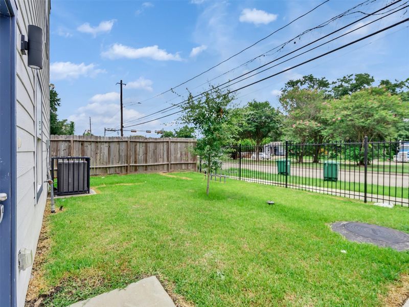 Grassy area on the side of the unit. Grassy area on the side of the unit.