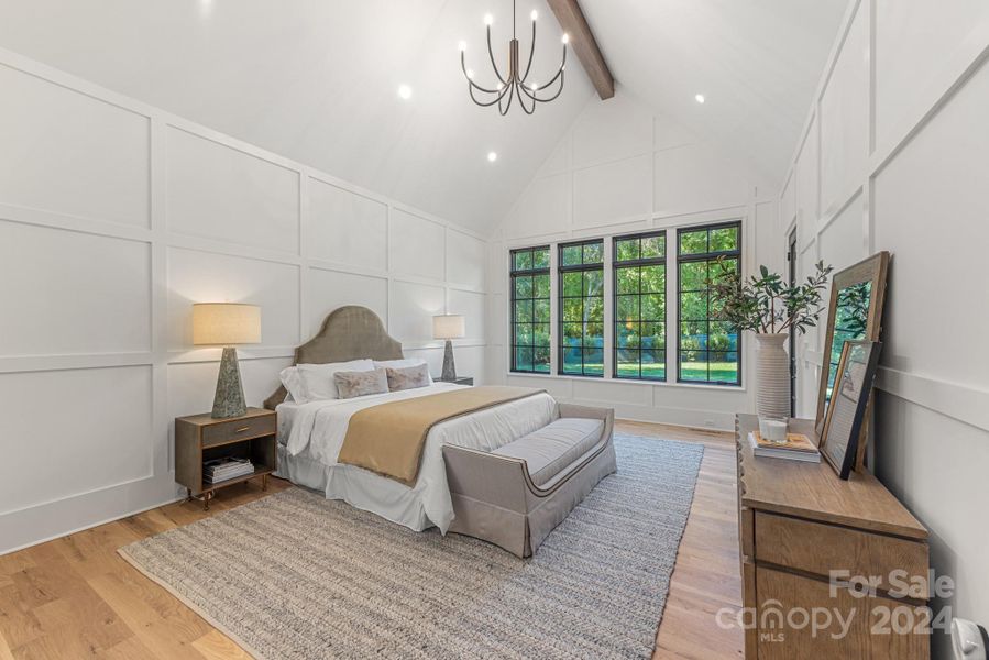 Beautiful primary bedroom on the main floor with tons of light