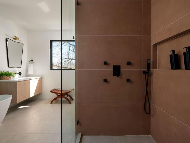 Bathroom featuring vanity and a walk in shower