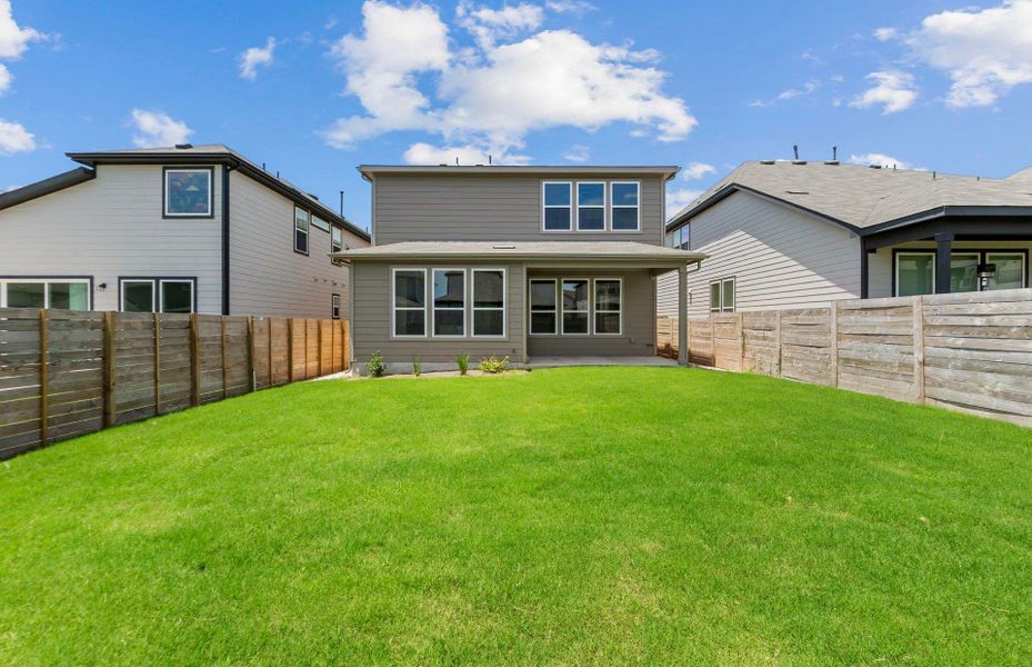 Front exterior of a new home in Horizon Lake, Leander, TX, highlighting curb appeal (Image 2). Front exterior of a new home in Horizon Lake, Leander, TX, highlighting curb appeal (Image 2).