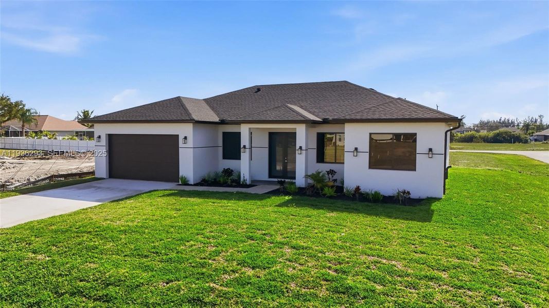 Front exterior of a new home in , Cape Coral, FL, highlighting curb appeal (Image 25).