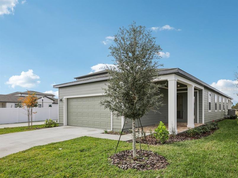 Front exterior of a new home in , Winter Garden, FL, highlighting curb appeal (Image 21).