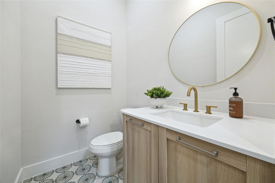 Chic powder room featuring modern fixtures, elegant vanity, and stylish tile flooring. Perfect blend of functionality and design. Chic powder room featuring modern fixtures, elegant vanity, and stylish tile flooring. Perfect blend of functionality and design.