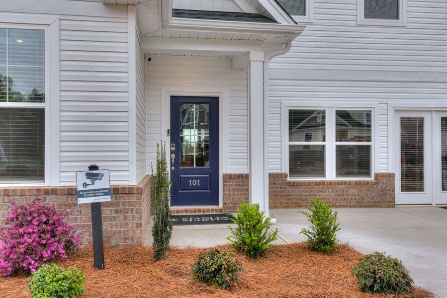 Exterior details and patio area of a home in Madison at Buice Lake, Acworth (Image 36).