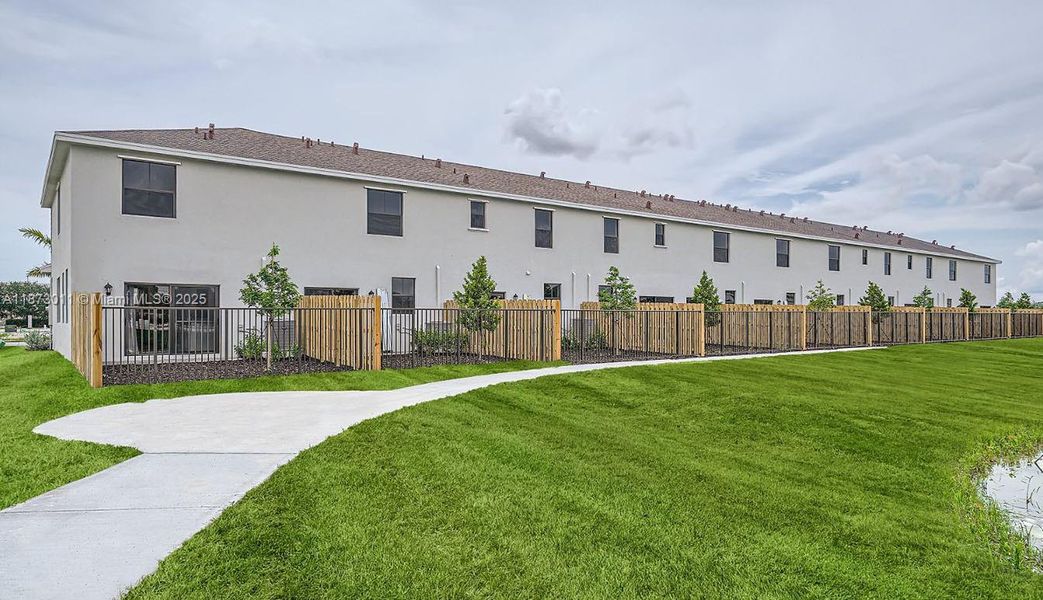 Front exterior of a new home in Palm Cay, Florida City, FL, highlighting curb appeal (Image 2).