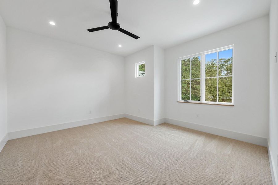 Unfurnished room with light carpet, recessed lighting, and ceiling fan Unfurnished room with light carpet, recessed lighting, and ceiling fan