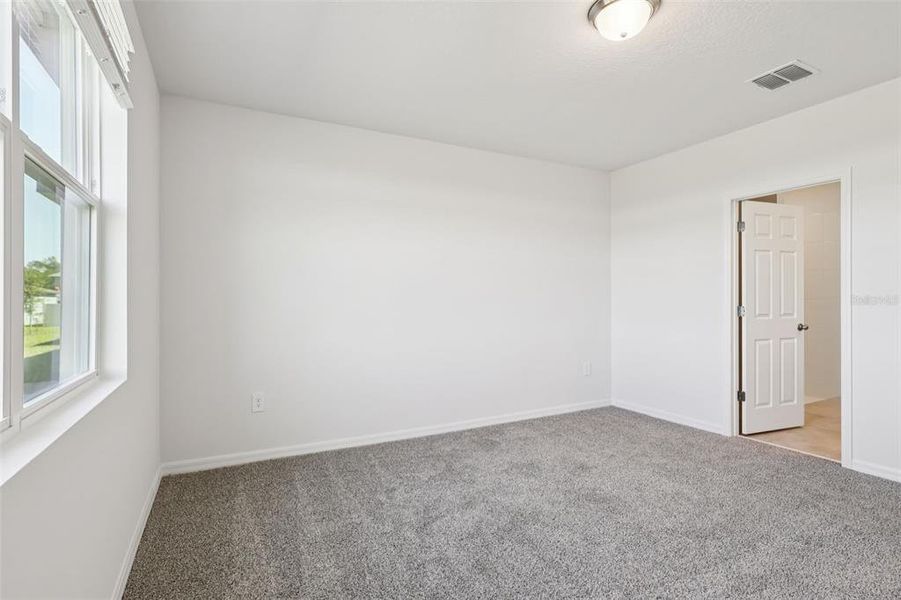 Spacious, unfurnished interior of a new home in Lake Deer Estates - Signature Series, Poinciana (Image 26).