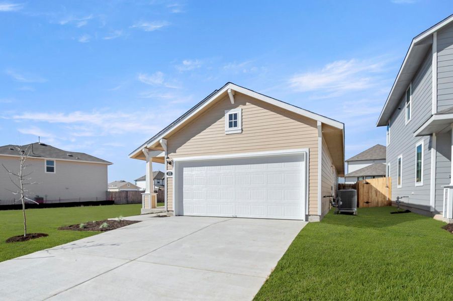 Front exterior of a new home in Hymeadow, Maxwell, TX, highlighting curb appeal (Image 21). Front exterior of a new home in Hymeadow, Maxwell, TX, highlighting curb appeal (Image 21).