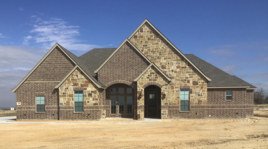 Representative exterior photo of a completed home built from the 100-2466-0718 by Abba River Homes in Stanford Estates, Springtown, TX (Image 1).