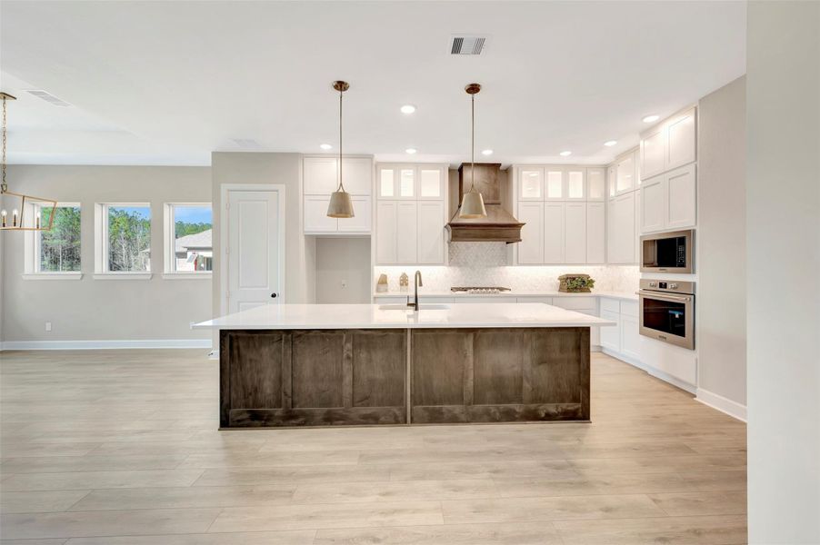Another view of this spacious Kitchen with high ceilings & lots of designer touches!