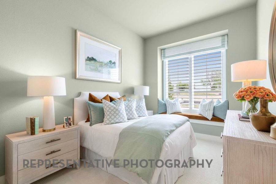 Bedroom featuring light carpet Bedroom featuring light carpet