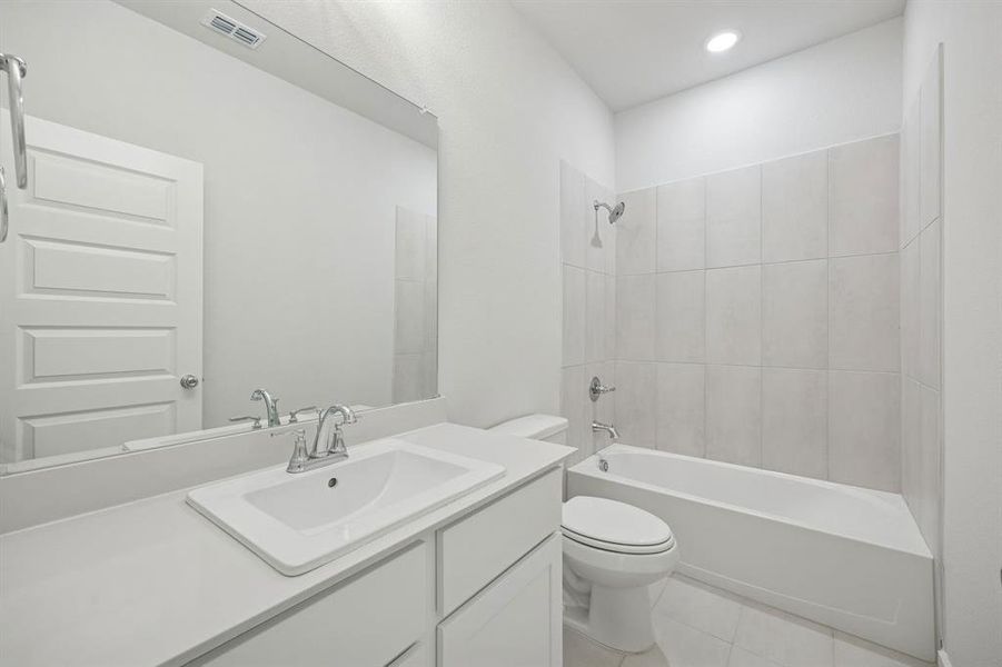 Bathroom in the Masters home plan by Trophy Signature Homes – REPRESENTATIVE PHOTO