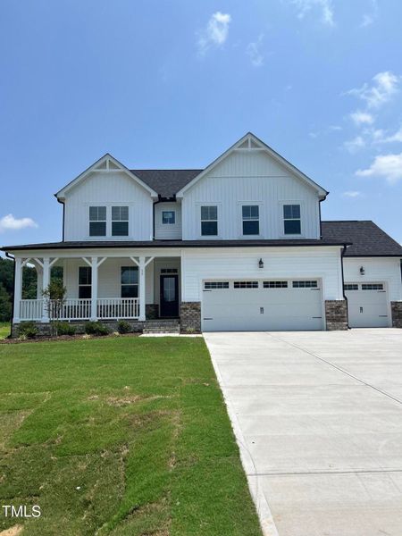 Front exterior of a new home in Tobacco Road, Angier, NC, highlighting curb appeal (Image 97). Front exterior of a new home in Tobacco Road, Angier, NC, highlighting curb appeal (Image 97).