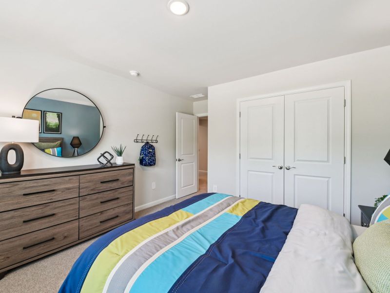 Secondary bedroom in the Taylorsville floorplan at a Meritage Homes community in Mebane, NC. Secondary bedroom in the Taylorsville floorplan at a Meritage Homes community in Mebane, NC.