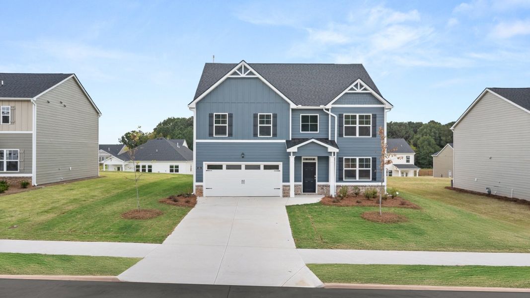Front exterior of a new home in Preserve at Dove Creek, Statham, GA, highlighting curb appeal (Image 1).