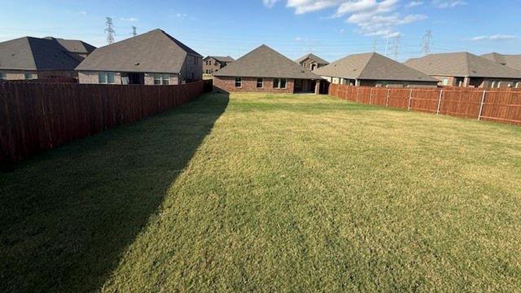 Exterior details and patio area of a home in Fireside by the Lake, Garland (Image 4).