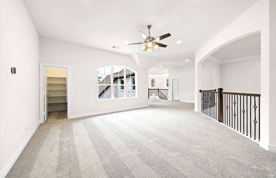 Representative unfurnished interior of a home built from the 4094 by Ravenna Homes in Artavia 70′, Conroe (Image 54).