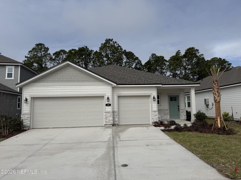 Front exterior of a new home in Reserve East, Flagler Beach, FL, highlighting curb appeal (Image 26).