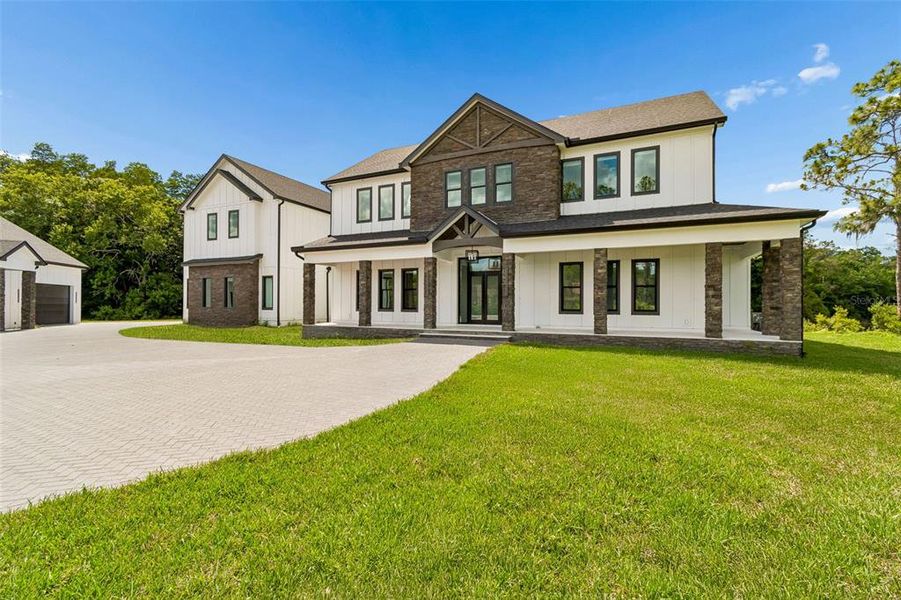 Front exterior of a new home in , Tarpon Springs, FL, highlighting curb appeal (Image 2). Front exterior of a new home in , Tarpon Springs, FL, highlighting curb appeal (Image 2).