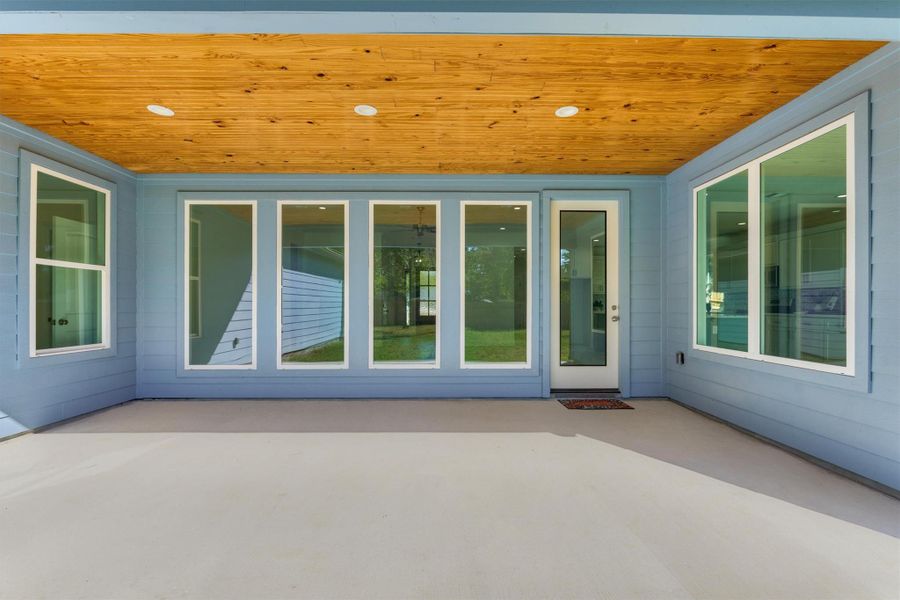 Relax in the shade with this incredible outdoor living area! Bring your patio furniture and outdoor grill to make the most of this peaceful covered patio. Relax in the shade with this incredible outdoor living area! Bring your patio furniture and outdoor grill to make the most of this peaceful covered patio.