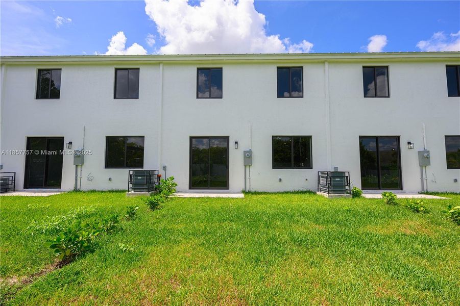 Front exterior of a new home in , Florida City, FL, highlighting curb appeal (Image 2). Front exterior of a new home in , Florida City, FL, highlighting curb appeal (Image 2).