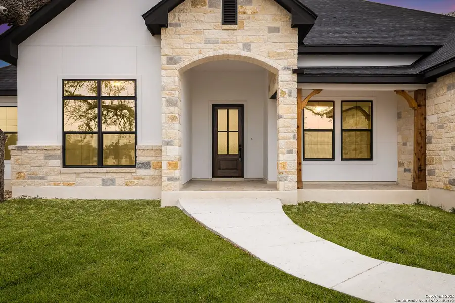 Exterior details and patio area of a home in , Spring Branch (Image 3).