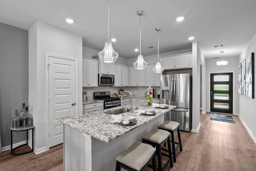 Photos shown are of a staged model home and are for illustration purposes only. Actual home features, finishes, and layout may vary.