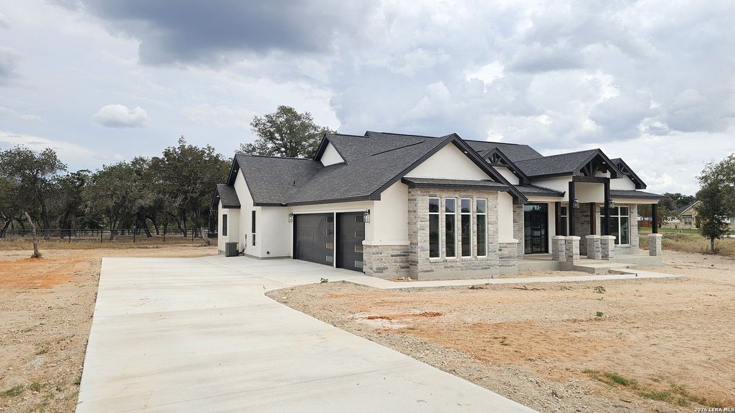 Front exterior of a new home in , Adkins, TX, highlighting curb appeal (Image 29).