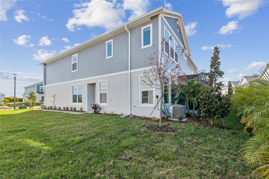 Exterior details and patio area of a home in North River Ranch – Townhomes, Parrish (Image 28).