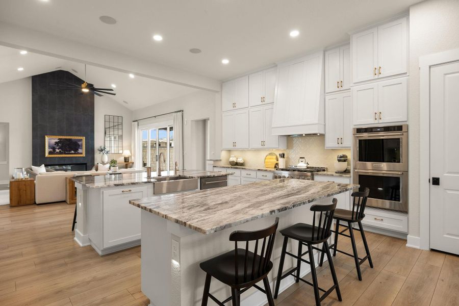 Impressive kitchen featuring dual islands and generous seating.