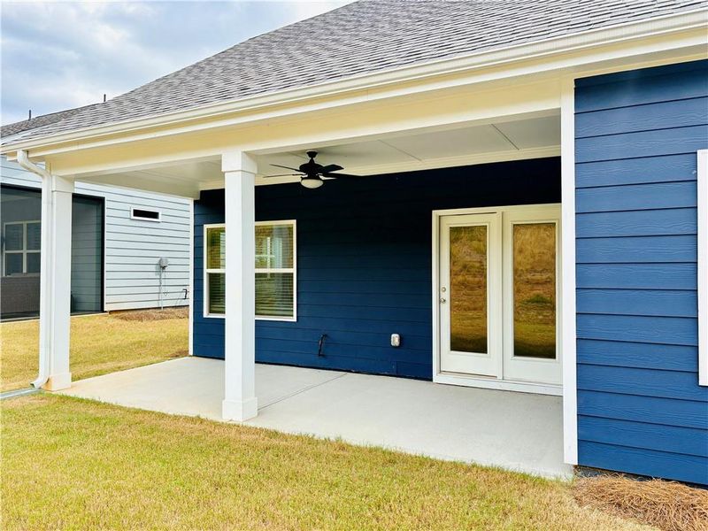 Exterior details and patio area of a home in Heritage Pointe at The Georgian, Villa Rica (Image 3).