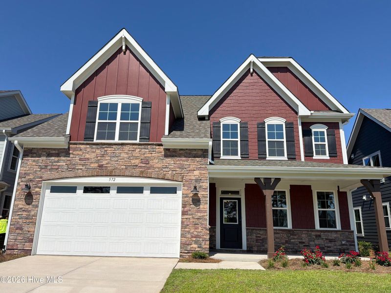Front exterior of a new home in Legacy Lakes, Aberdeen, NC, highlighting curb appeal (Image 2). Front exterior of a new home in Legacy Lakes, Aberdeen, NC, highlighting curb appeal (Image 2).