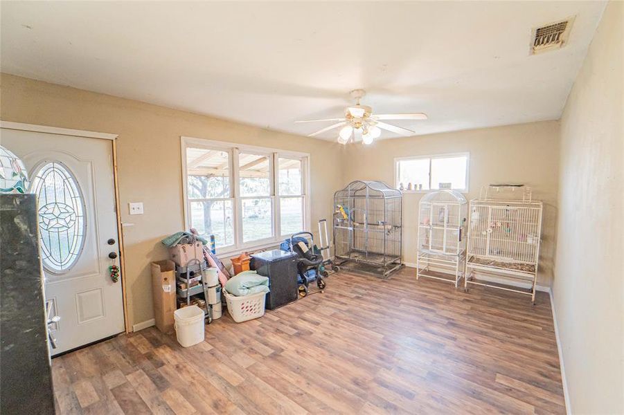 Foyer with a ceiling fan and wood finished floors Foyer with a ceiling fan and wood finished floors