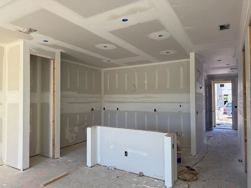 Sophisticated kitchen featuring a large central island and soaring 9-foot ceilings