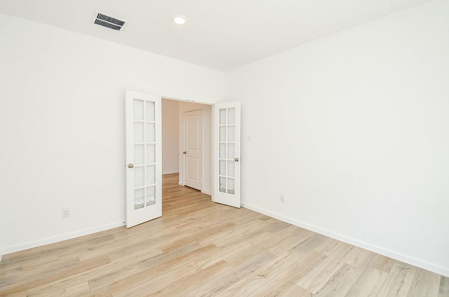 Another view of the office with glass French doors for privacy.