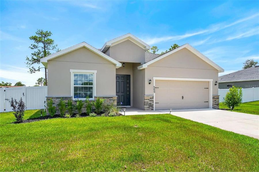 Front exterior of a new home in Silver Springs Shores, Ocala, FL, highlighting curb appeal (Image 29). Front exterior of a new home in Silver Springs Shores, Ocala, FL, highlighting curb appeal (Image 29).