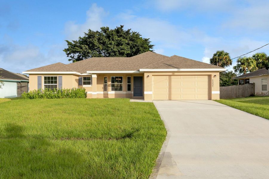 Front exterior of a new home in , Port St. Lucie, FL, highlighting curb appeal (Image 2). Front exterior of a new home in , Port St. Lucie, FL, highlighting curb appeal (Image 2).