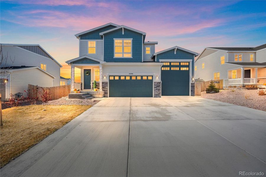 Front exterior of a new home in Paint Brush Hills, Peyton, CO, highlighting curb appeal (Image 30).