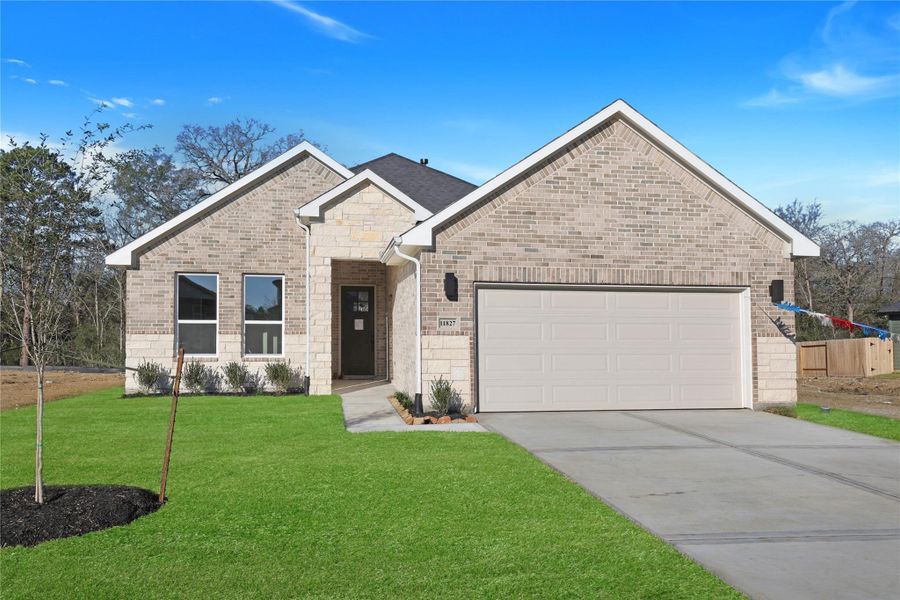 Front exterior of a new home in Lexington Heights, Willis, TX, highlighting curb appeal (Image 1). Front exterior of a new home in Lexington Heights, Willis, TX, highlighting curb appeal (Image 1).