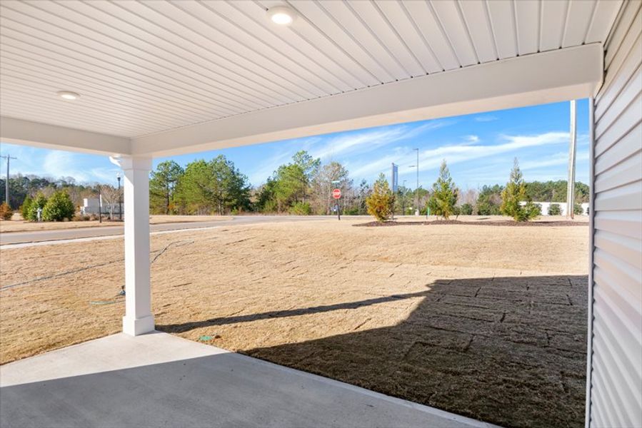Exterior details and patio area of a home in Wren Woods 2-Story, Gray Court (Image 3).